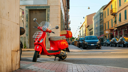 Piombino, Tuscany, Italy - 17 June 2018. The red motorcycle on city street
