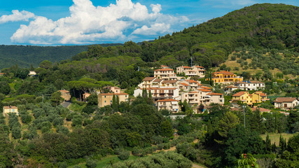 Fototapeta na wymiar Sassetta, Livorno, Tuscany, Italy - 25 June 2018. View of the mountains, valley and villas