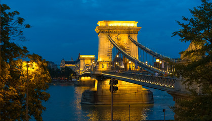 Obraz premium Budapest, Hungary. Panoramic view of the Danube River and illuminated Chain Bridge at night