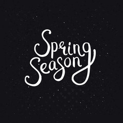 Fototapeta na wymiar Spring Season Phrase on a Dotted Black Background