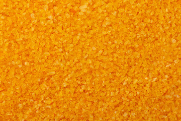 Texture Yellow aromatic sea salt for bath with extracts of healing herbs