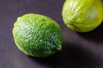 Fresh lime fruit on wooden table. Detox diet