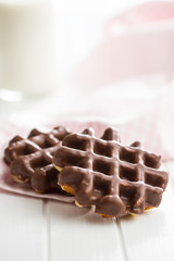 Waffles with chocolate topping.