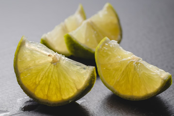 Fresh lime slices on a wooden table. Detox diet