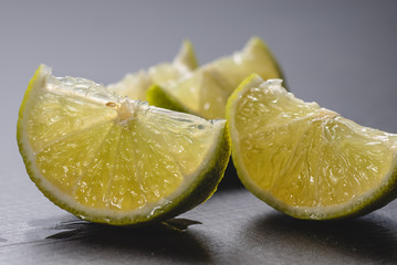 Fresh lime slices on a wooden table. Detox diet