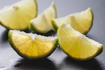 Fresh lime slices on a wooden table. Detox diet