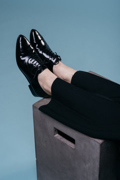 female legs in black shoes