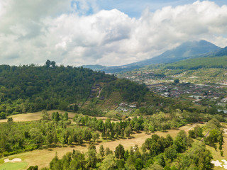 Fototapeta na wymiar Green Bali landscape. Aerial drone view to Bedugul village. Indonesia.