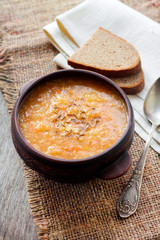 Kapustnyak - traditional ukrainian winter soup with sauerkraut, millet and meat