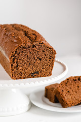 Homemade gingerbread cake on white plate. Honey cake.
