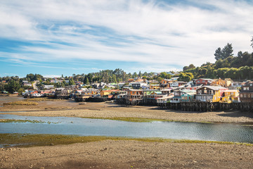 Gamboa Palafitos Stilt Houses at low tide - Castro, Chiloe Island, Chile