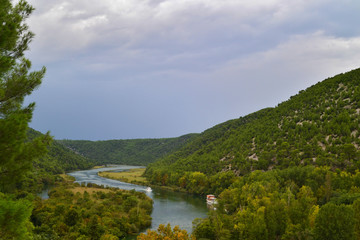Obraz premium Panorama on the river Krka and singhtseeing boats the national Park Krka. Summer, cloudy day. Croatia. 
