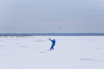 a man kiting on the lake