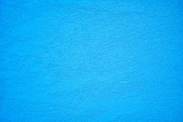 Fototapeta na wymiar The texture of plastered deep sky blue wall, background