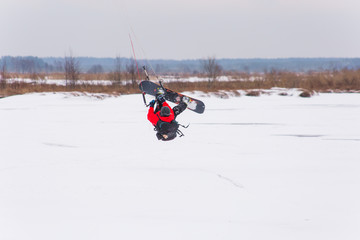 a man kiting on the lake