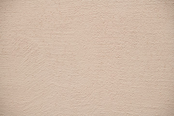 The texture of plastered beige wall, background
