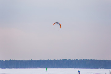 a man kiting on the lake