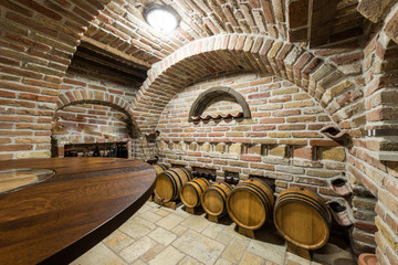 Wine cellar with barrels and wooden top