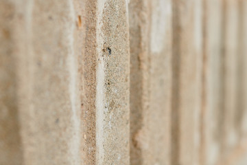 Striped texture of bricks or cement blocks, background, close-up