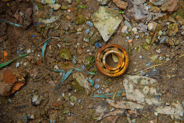 Rusty old bearing. Garbage for disposal. Rusty metal for secondary production. Rusty spare lies on...