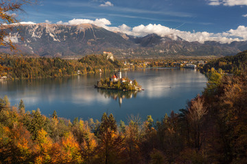 Beautiful mountain lake Bled with small Pilgrimage Church, Slovenia, autumn landscape.
