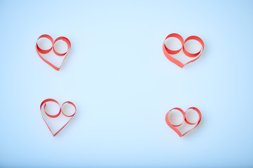 Valentine's Day theme with composition of red paper hearts for cards and backgrounds