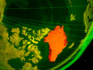 Greenland on green model of planet Earth with network at night. Concept of digital technology, communication and travel.