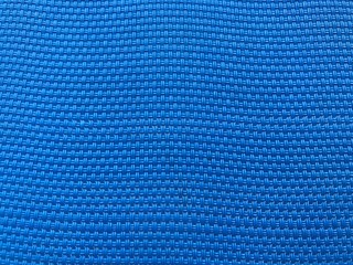 blue polyester mesh of sunbed as background