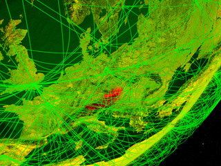 Austria on green model of planet Earth with network at night. Concept of digital technology, communication and travel.