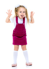 Naklejka premium Little girl shows tongue.
