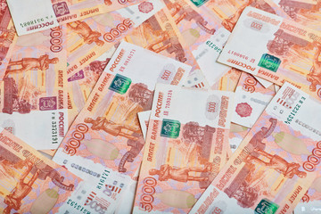 A lot of russian money banknotes of roubles, background