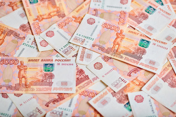 A lot of russian money banknotes of roubles, background