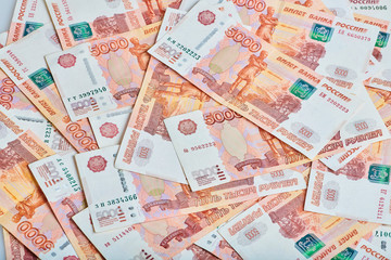 A lot of russian money banknotes of roubles, background