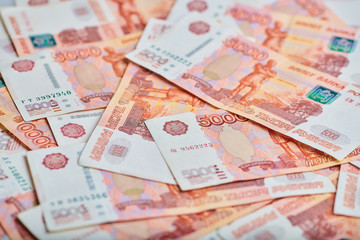 A lot of russian money banknotes of roubles, background