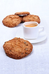 Perfect morning breakfast with Classic espresso in white cup, cake and chocolate on white background.