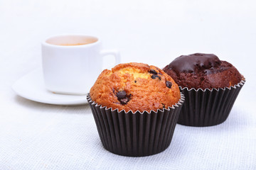 Perfect morning breakfast with Classic espresso in white cup, cake and chocolate on white background.