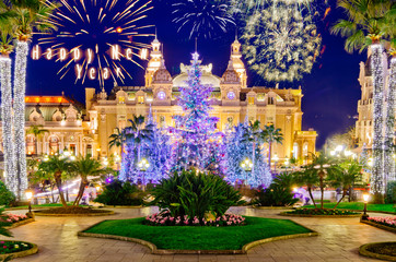 Christmas tree in front of the palace of casino of Monaco at dusk, Montecarlo, France
