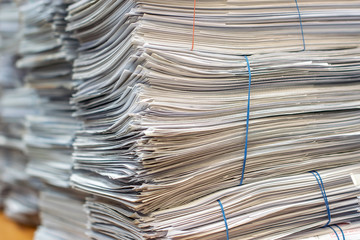 bundles bales of paper documents. stacks packs pile on the desk in the office