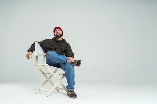 male casting director sitting on a folding chair