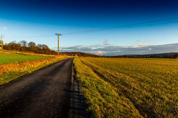 Autumn countryside asphalt road.