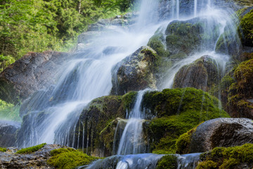 Beautiful artificial waterfalls, lush green mossy stones. (izvorul minunilor) Romania, Stana de Vale