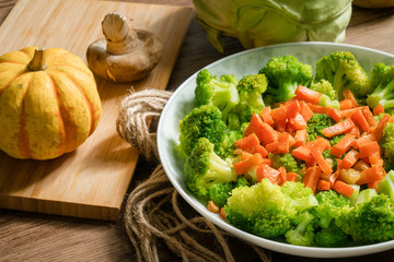 Green broccoli with wooden background