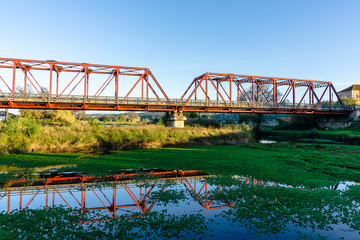 metal bridge red color in raposa, almeirim, portugal.