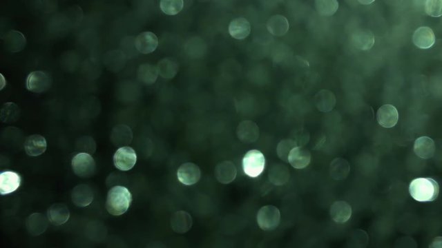 Amazing green bokeh, defocused background in 4k. Perfect for making creative mood in your project.