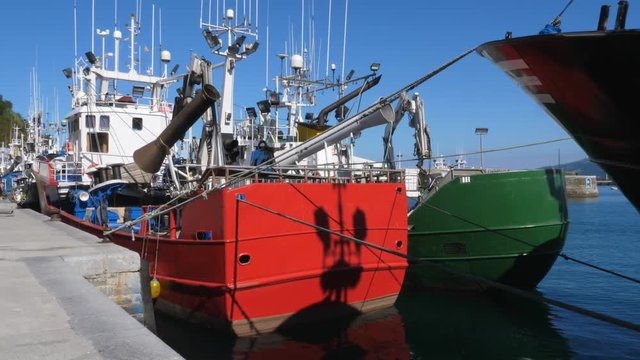 Industrial fishing boats moored in the harbour of Getaria, Spain.
