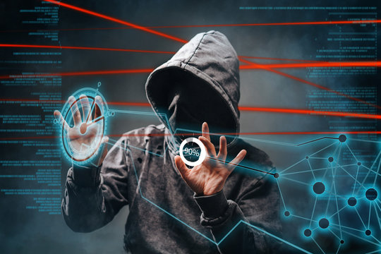 Cyber crime. . Male hacker accessing to personal information. Hooded man with obscured face touching digital panel with mixed media and binary code. Virtual crime, cybersecurity concept.