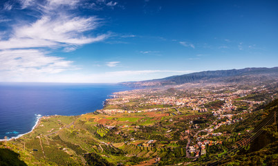 Fototapeta na wymiar This panoramic photograph, taken at a Mirador in Los Realejos, shows the north coast of Tenerife and the Orotava Valley.