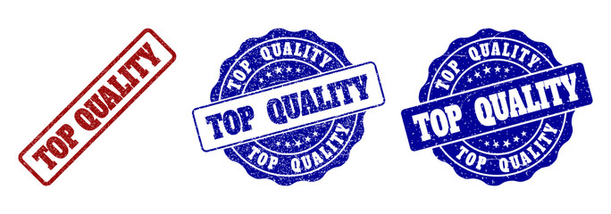TOP QUALITY grunge stamp seals in red and blue colors. Vector TOP QUALITY marks with grunge effect. Graphic elements are rounded rectangles, rosettes, circles and text captions.