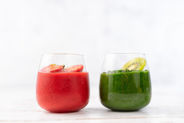 Colorful red and green smoothie in two glasses
