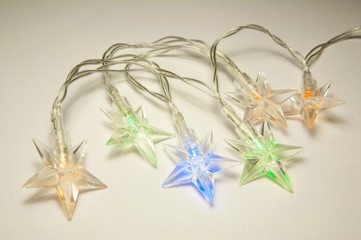 Colorful christmas garland lights from LED with silicone stars.